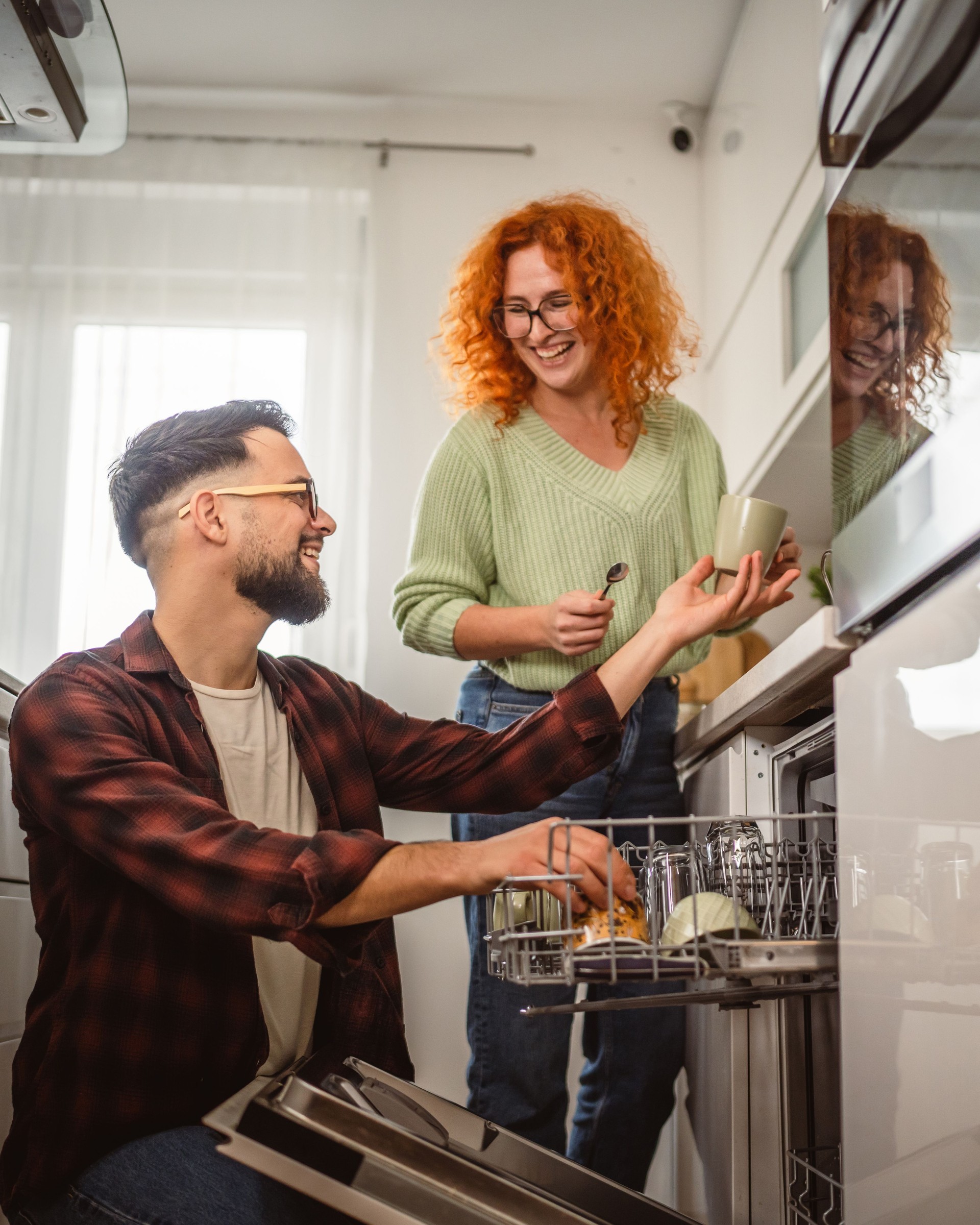 dishes in dishwasher in kitchen