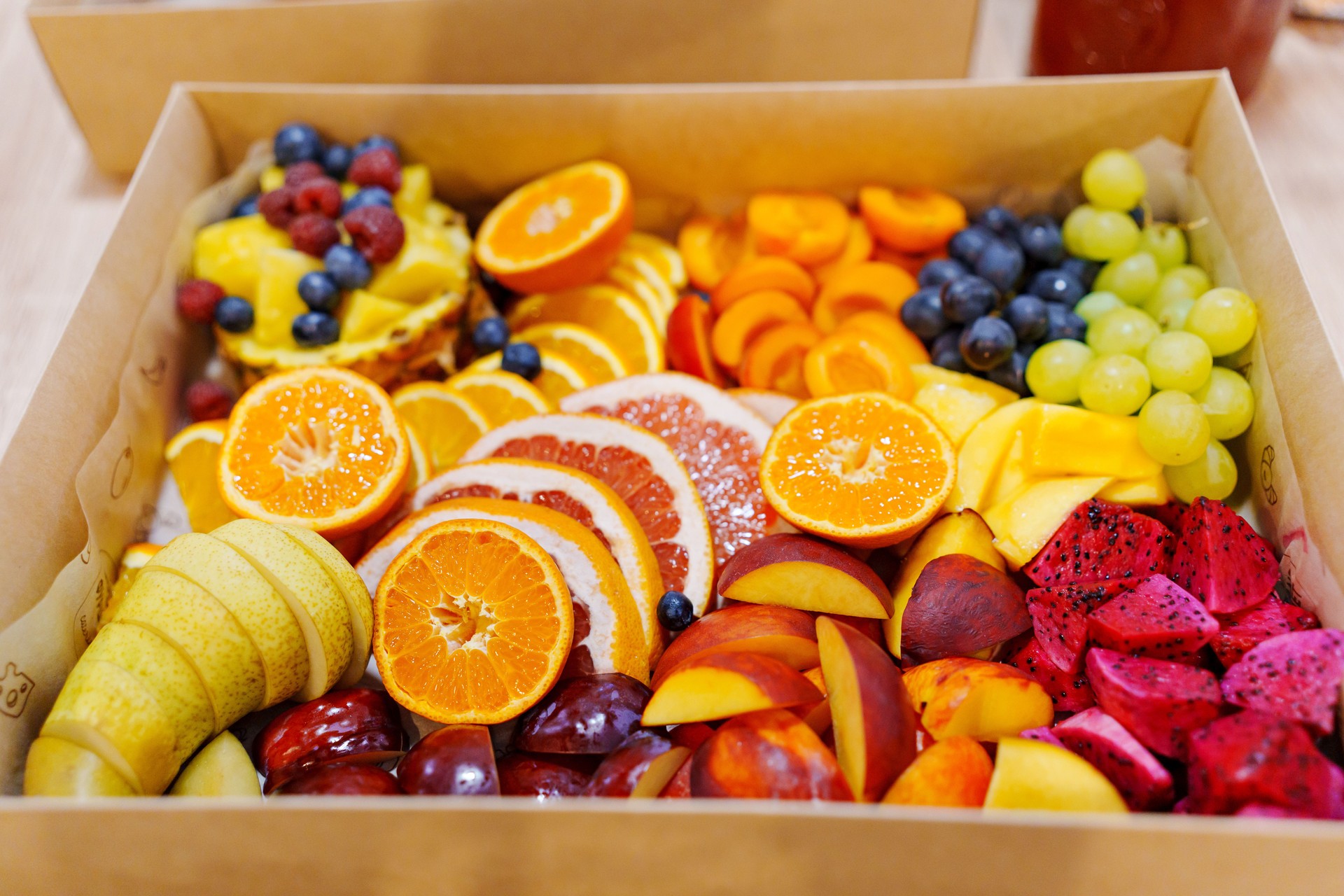 A large fruit platter with exotic berries and fruits.