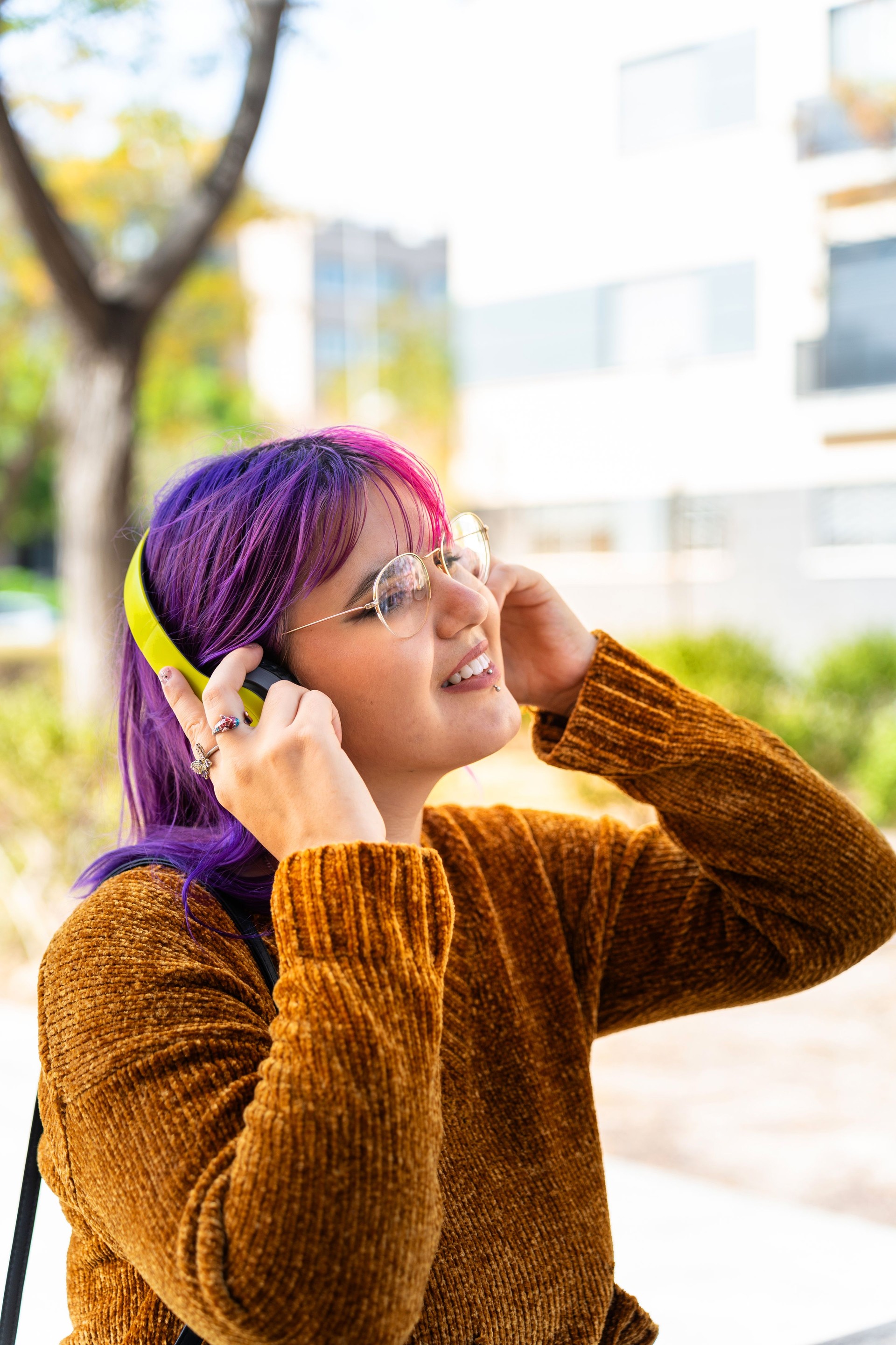 Plus size autistic girl with pink hair smiling happily. Our inner world.