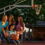 Portrait young disability women with her friends on basketball